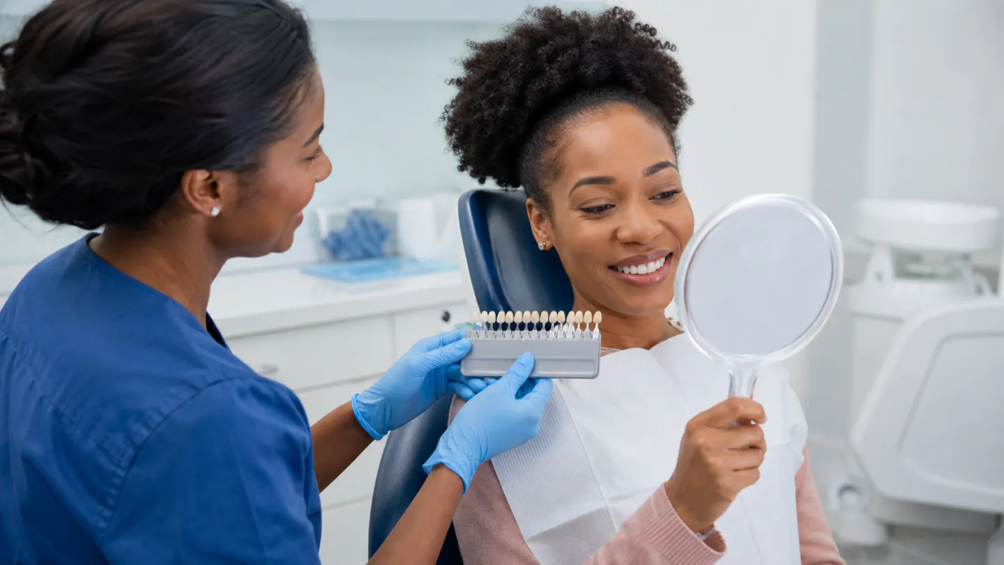 A Winnipeg dental patient discussing professional teeth whitening options