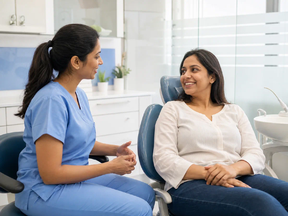 Dental team member speaking with a patient in a treatment room